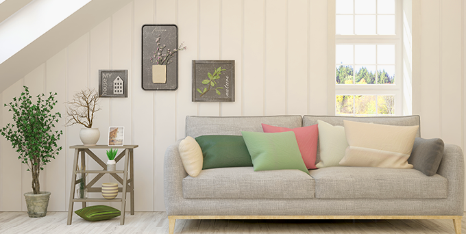 Beige couch in living room showcasing renter's highlights of valuables for multifamily property insurance