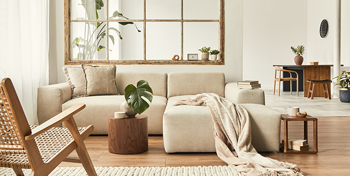 Cream couch in resident living room highlighting products to be covered by apartment property insurance